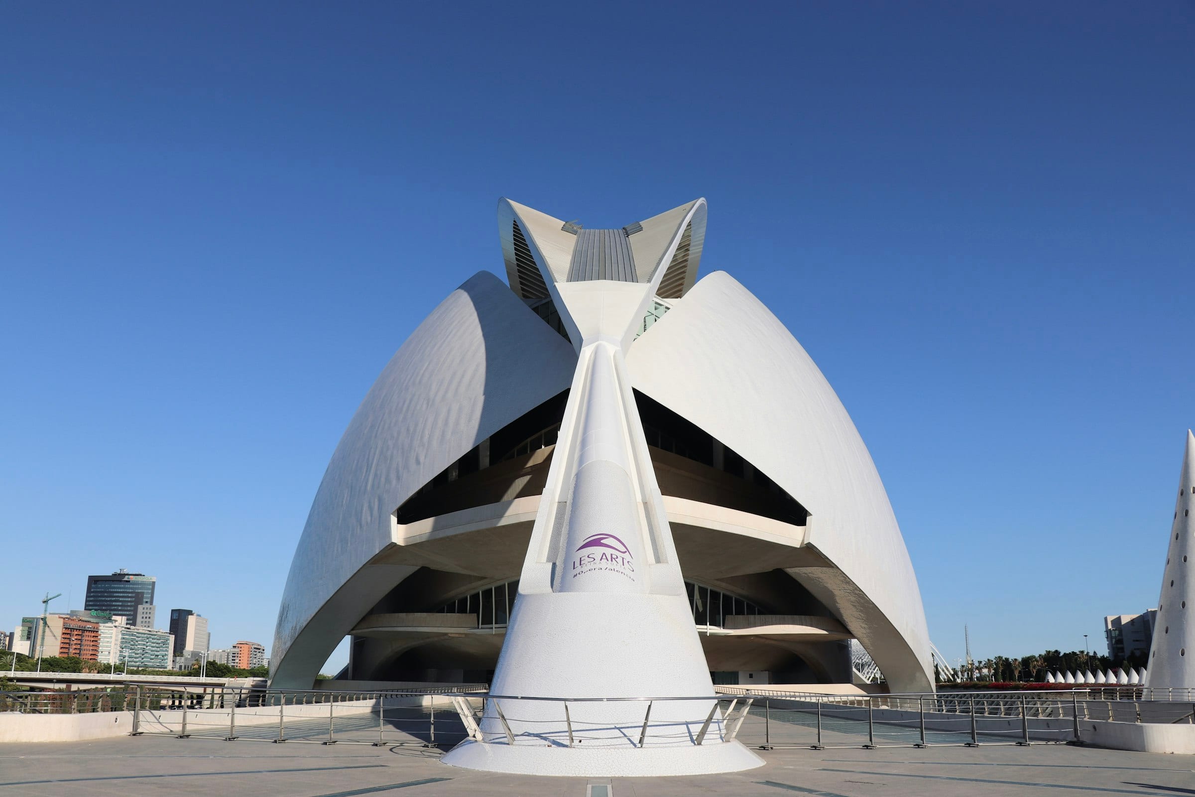 A sculptural white Calatrava architectural form against a deep blue sky, evoking premium enterprise AI solutions